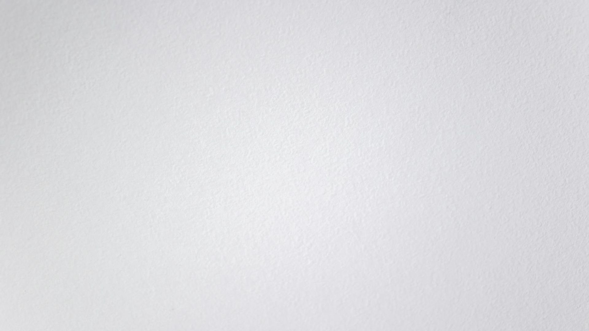 Abstract background with soft violet light patterns suggesting calm space.